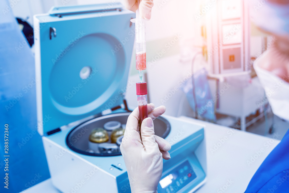 Platelet-Rich plasma preparation. Plasma in syringe. Centrifuge. Platelet-Rich plasma preparation. Plasma in syringe. Centrifuge.