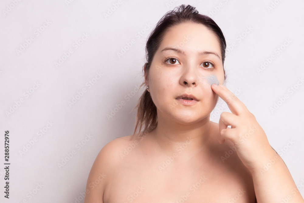 Portrait of woman without clothes, SPA treatment for skin care. Face mask. White background. Portrait of woman without clothes, SPA treatment for skin care. Face mask. White background.