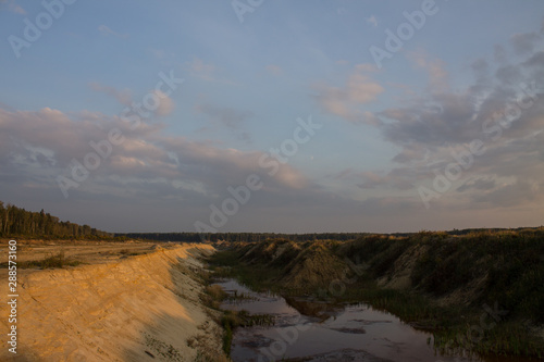 Limestone quarry summer evening at sunset