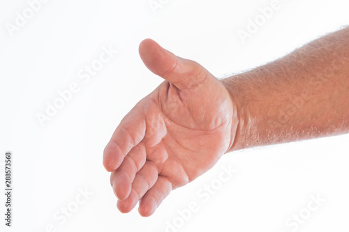 Colorful photo of a man's hand shaking in the form of a greeting on a white background. Space to write.