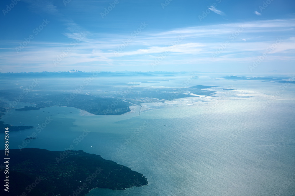  Vancouver,Canada-August 28, 2019: Aerial view of Strait of Georgia, Burrard Inlet and Vancouver in the morning 