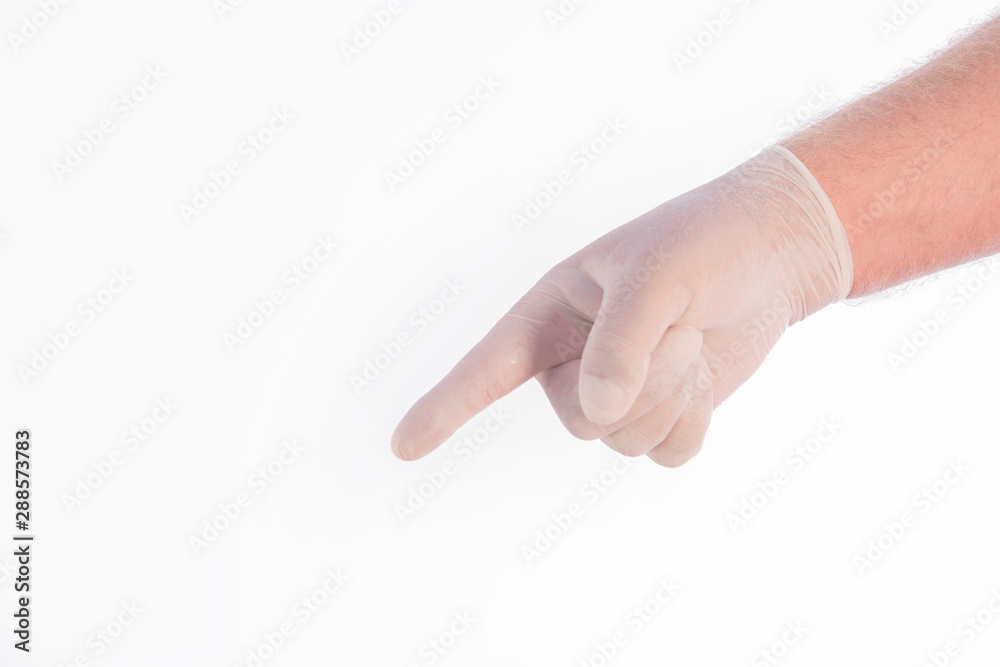 A hand covered by a glove pointing to the ground on a white background. Space to write.