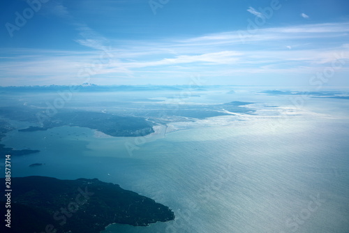  Vancouver,Canada-August 28, 2019: Aerial view of Strait of Georgia, Burrard Inlet and Vancouver in the morning 