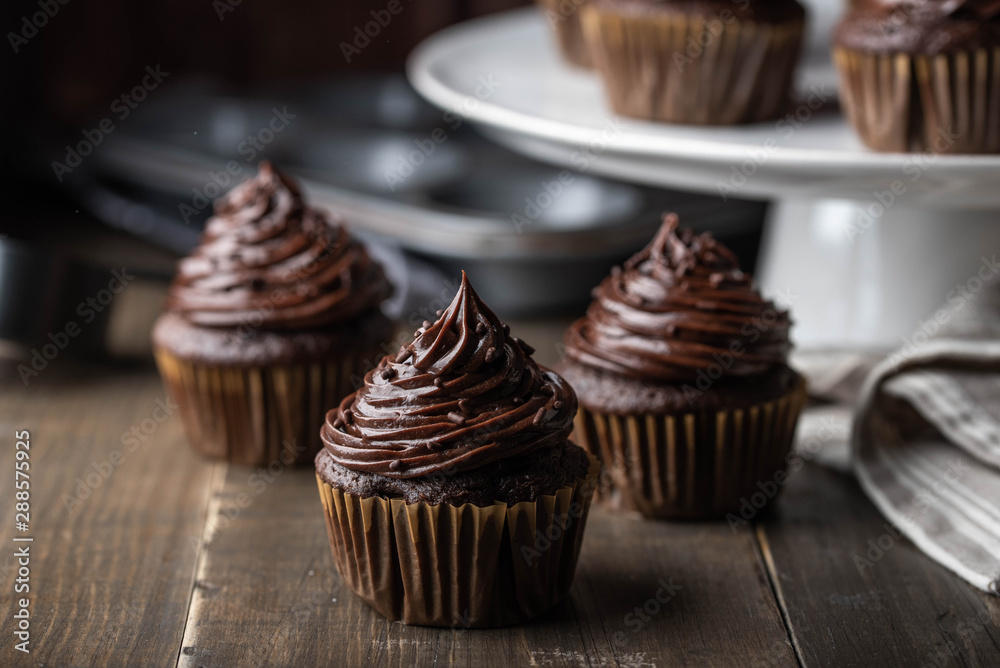 chocolate cupcake on dark wooden background chocolate cupcake on dark wooden background