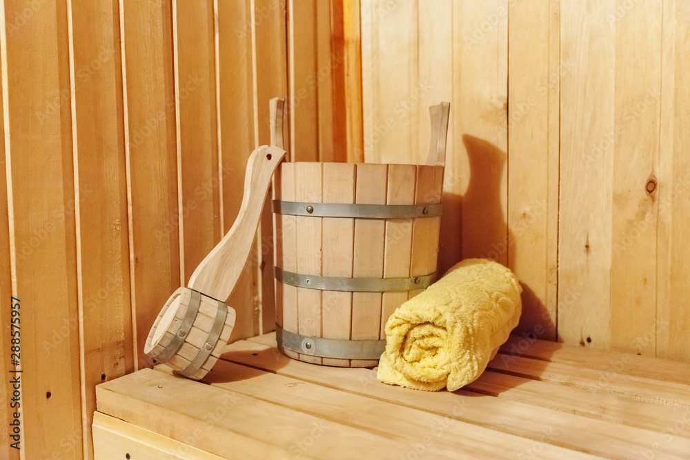 Interior Finnish sauna steam room with traditional sauna accessories basin scoop towel. Traditional old Russian bathhouse SPA Concept. Relax village bath concept Stock Photo | Adobe Stock