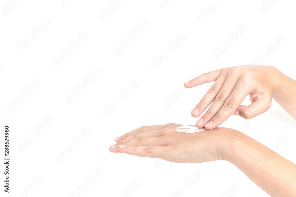 Hand skin care. Closeup on woman's hands applying moisturizing hand cream on. Cream for hands and treatment.