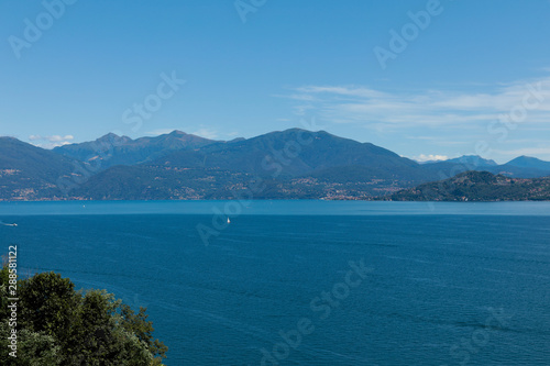 Lago maggiore ore lake maggiore beautiful panorama sunny day with blue sky and fluffy clouds