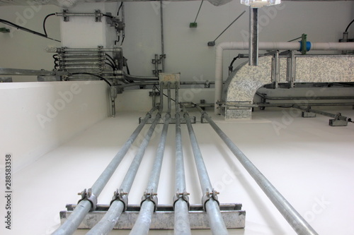 Conduit and clamp for cable electric ,Electrical Conduit with Clamp Installation on Roof ,Selective focus.