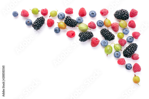 top view of fresh various berry fruits as frame background isolated on white background