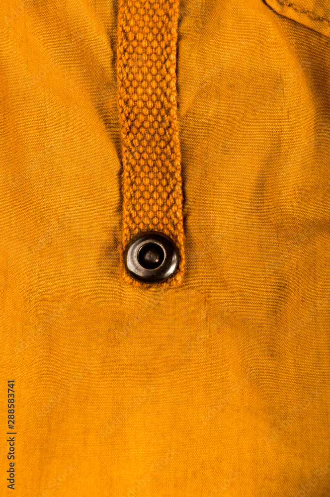 clothing items stonewashed cotton fabric texture with seams, clasps, buttons and rivets, macro clothing items stonewashed cotton fabric texture with seams, clasps, buttons and rivets, macro