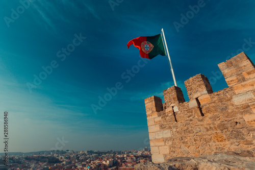 Portugal flag on top of a medieval tower
