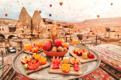 Travel in Cappadocia Colorful hot air balloons flying over the valley sunrise time with .special breakfast travel destination in Turkey photo