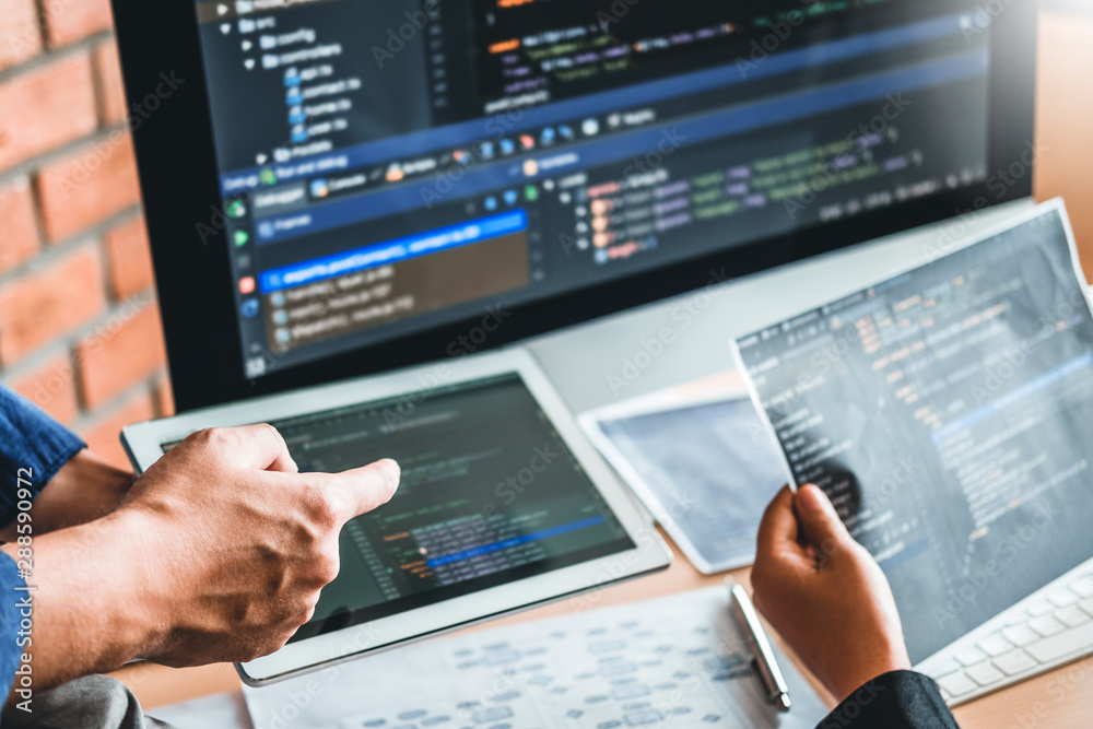 Developing programmer Team Development Website design and coding technologies working in software company office Developing programmer Team Development Website design and coding technologies working in software company office