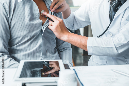 Doctor Measuring arterial blood pressure man patient Health care in hospital