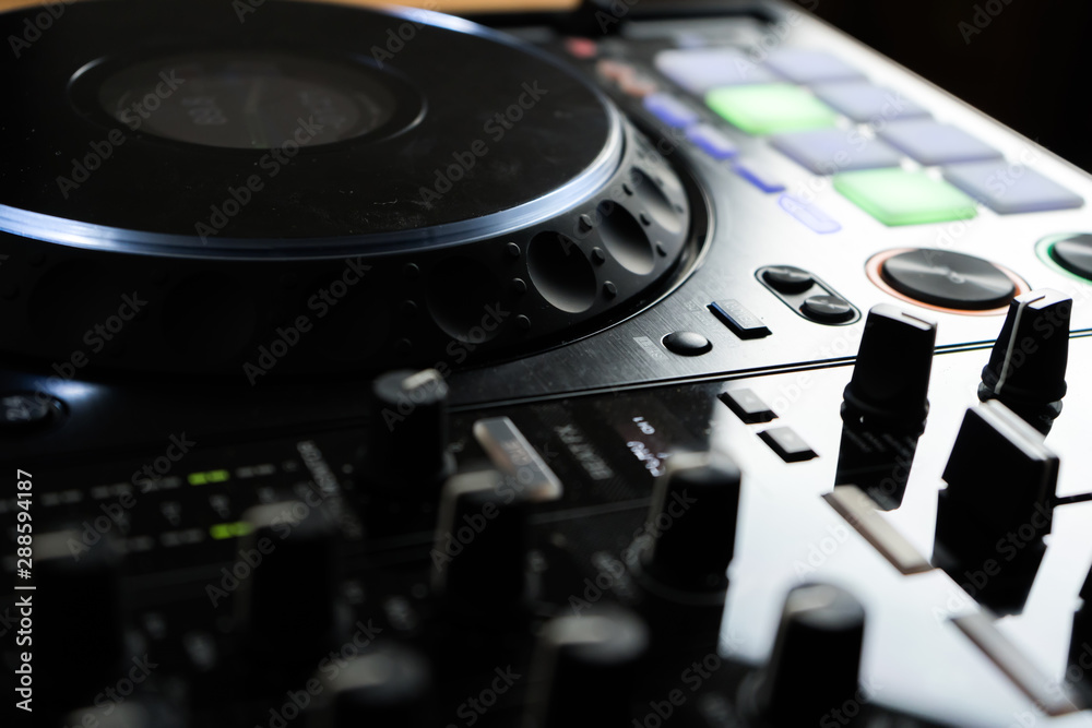 Close up DJ mixer player and sound console for house music party. DJ