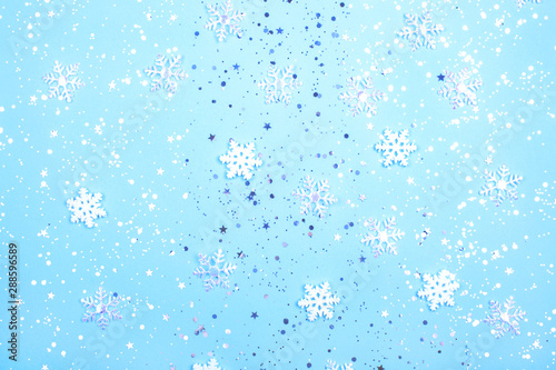 New Year or winter composition with snow flakes and glitter.
