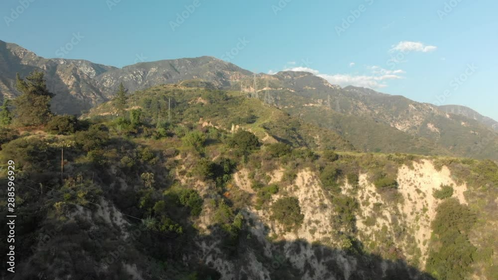 Aerial of Power Lines on a Verdant Mountain Aerial of Power Lines on a Verdant Mountain