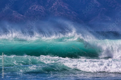 Fototapeta Naklejka Na Ścianę i Meble -  Stunning backlit wave crashing at Rainbows Beach on Maui