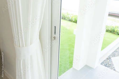 Close up of white modern curtain detail of Holder, interior detail. photo