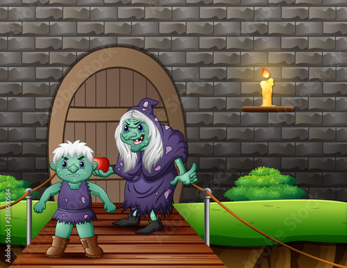 Old evil witch with a giant in front the house