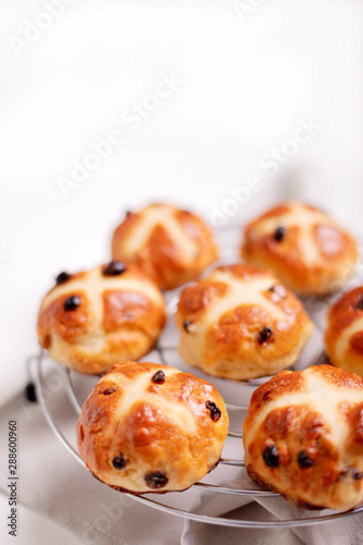 Buns marked with a cross and containing dried fruit, traditionally eaten during Lent.