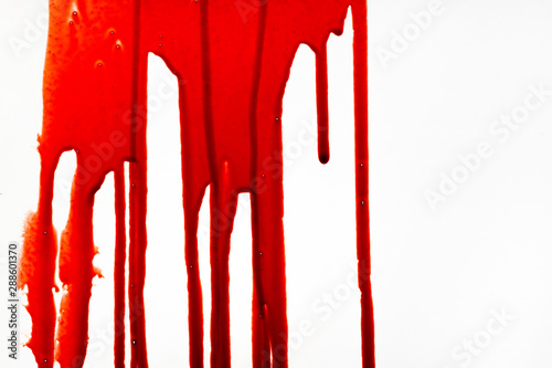Blood dripping down on white background.