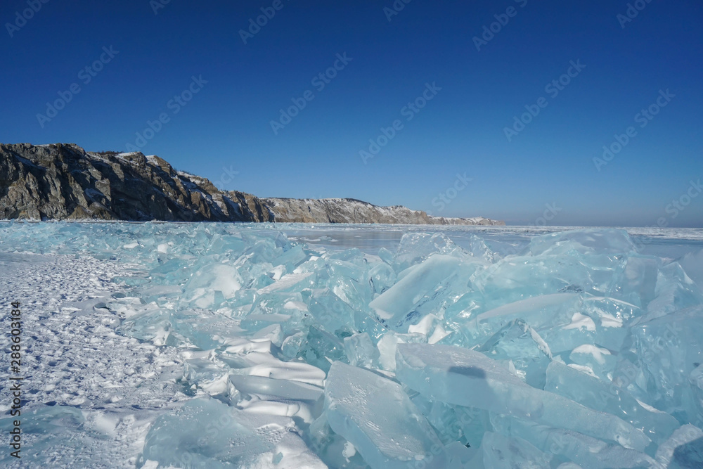glow blue beautiful ice crystal sheets in Baikal lake during winter season in Irkutsk glow blue beautiful ice crystal sheets in Baikal lake during winter season in Irkutsk