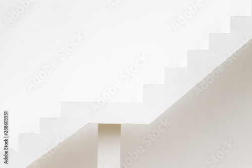 White staircase on concrete wall background (Concept for career path, target aiming, aspiration)
