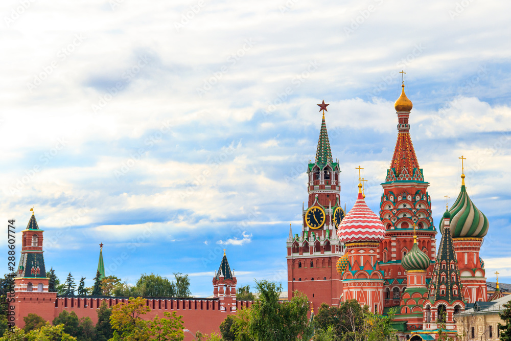 View of St. Basil's Cathedral and Spasskaya tower of Kremlin on Red Square in Moscow, Russia