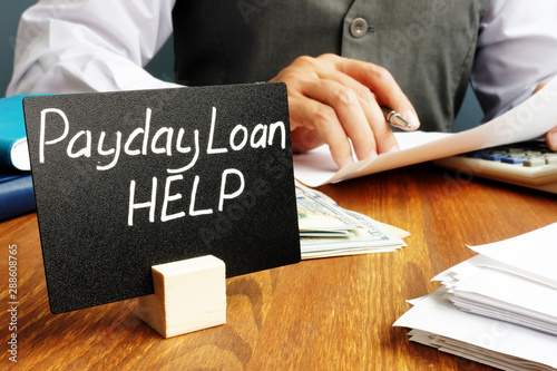 Φωτογραφία Plate with sign Payday loan help and working manager.