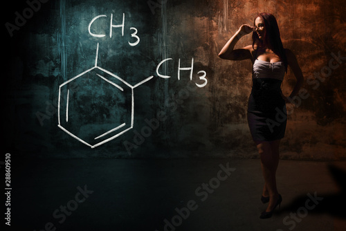 Sexy girl or secretary or female student presenting handdrawn chemical formula of Ortho-xylene o-xylene photo