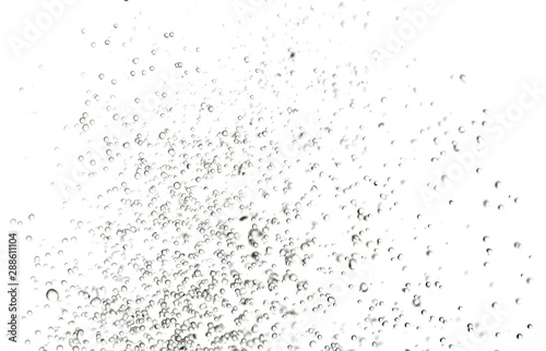 splashes, jets and drops of water hovering in the air on a white background