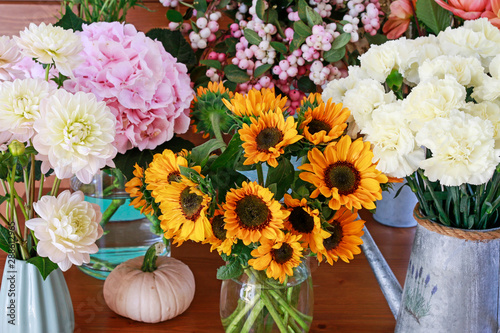 Sunflowers, dahlias, carnations and hydrangeas in flower shop.