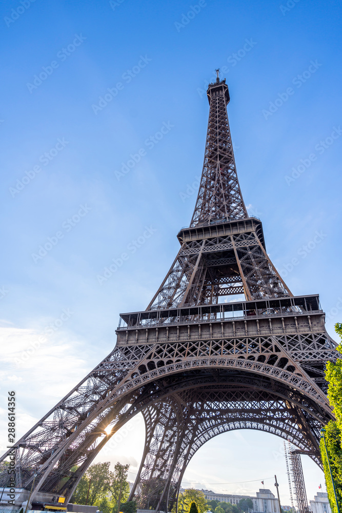 The majestic Eiffel Tower in sun glare