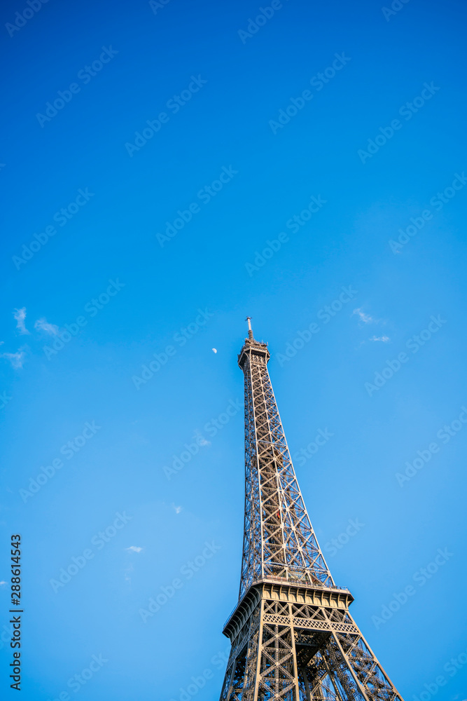 The top of the Eiffel Tower in the sunlight