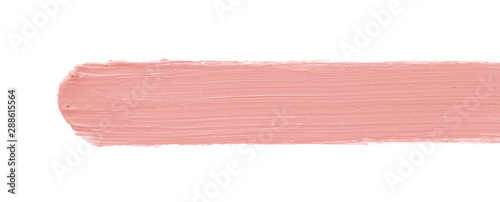Color corrector stroke isolated on white background. Peach color correcting cream concealer smudge smear swatch sample. Makeup base foundation creamy texture