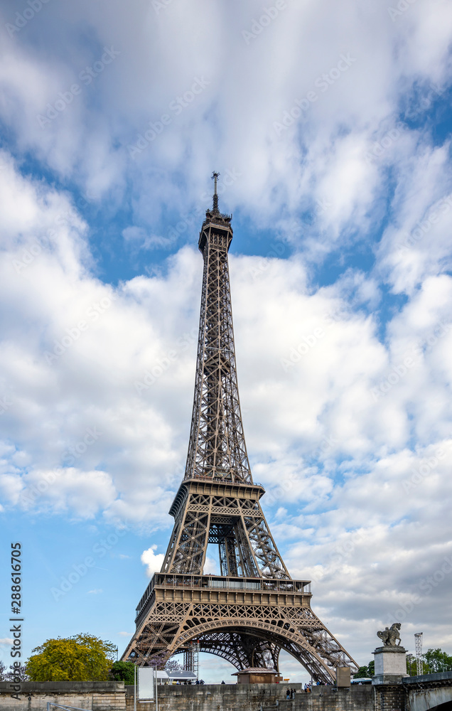View of the Eiffel Tower rushing into the clouds