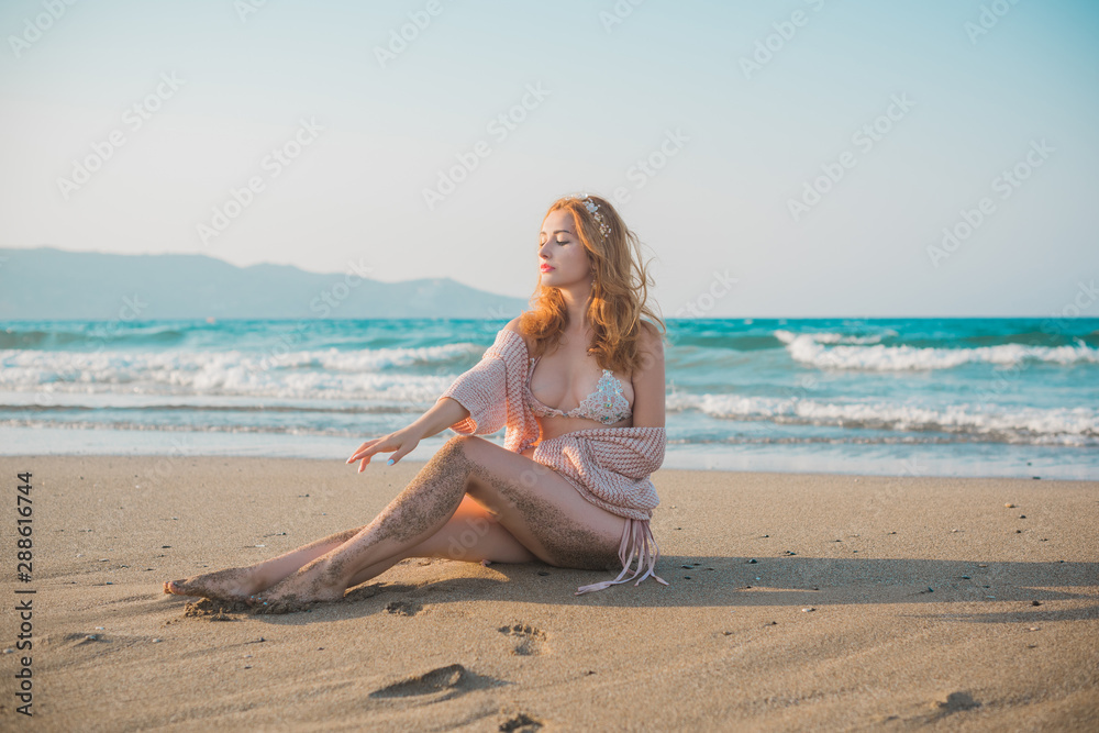 Freedom concept, redhead woman rest at sea, vacation and holidays time Freedom concept, redhead woman rest at sea, vacation and holidays time