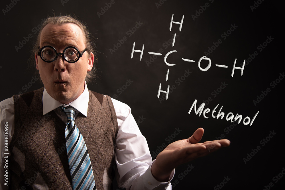 Professor presenting handdrawn chemical formula of Methanol
