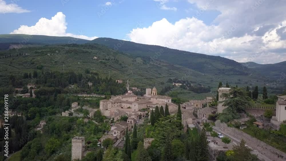 Drone aerial video of the small ancien Spello village, in Umbria region, Italy at summer season.