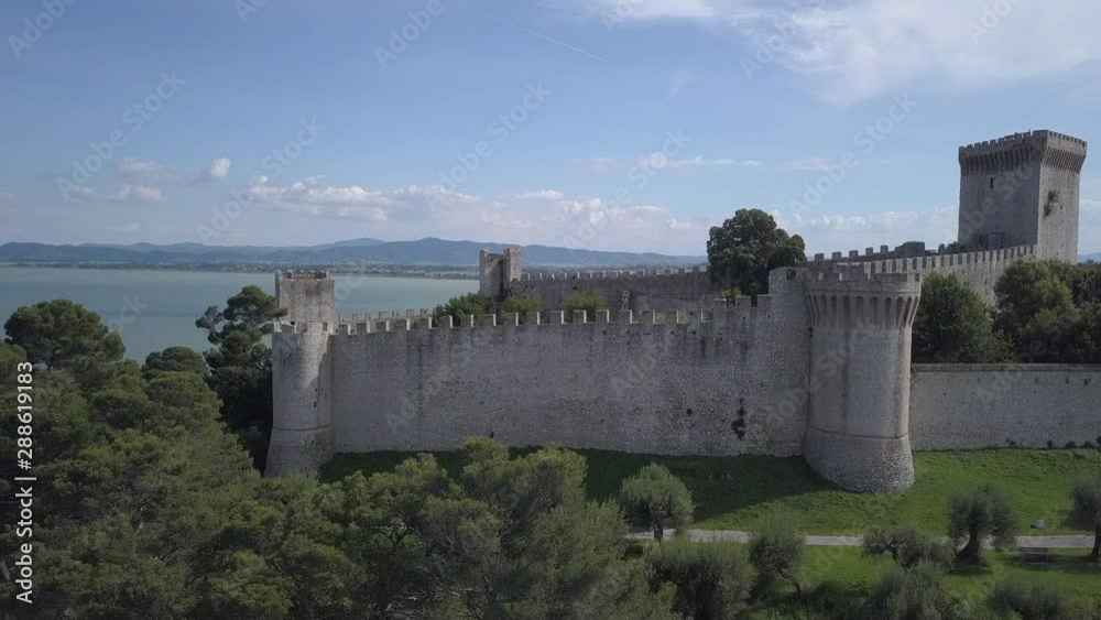 Drone aerial video of the small ancien Castiglione del Lago village, in Umbria region, Italy at summer season.