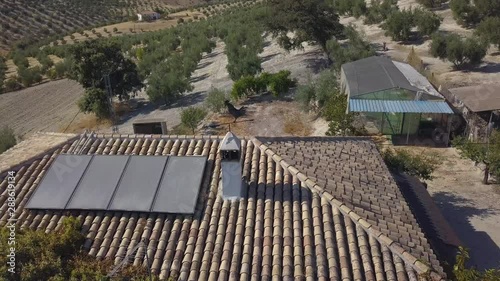 Wallpaper Mural Aerial shot over a rural house in Spain with solar panels on the roof. Torontodigital.ca
