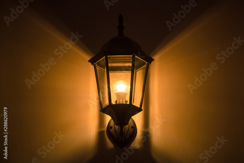 lamp post or lantern with light bulbs decor on wall