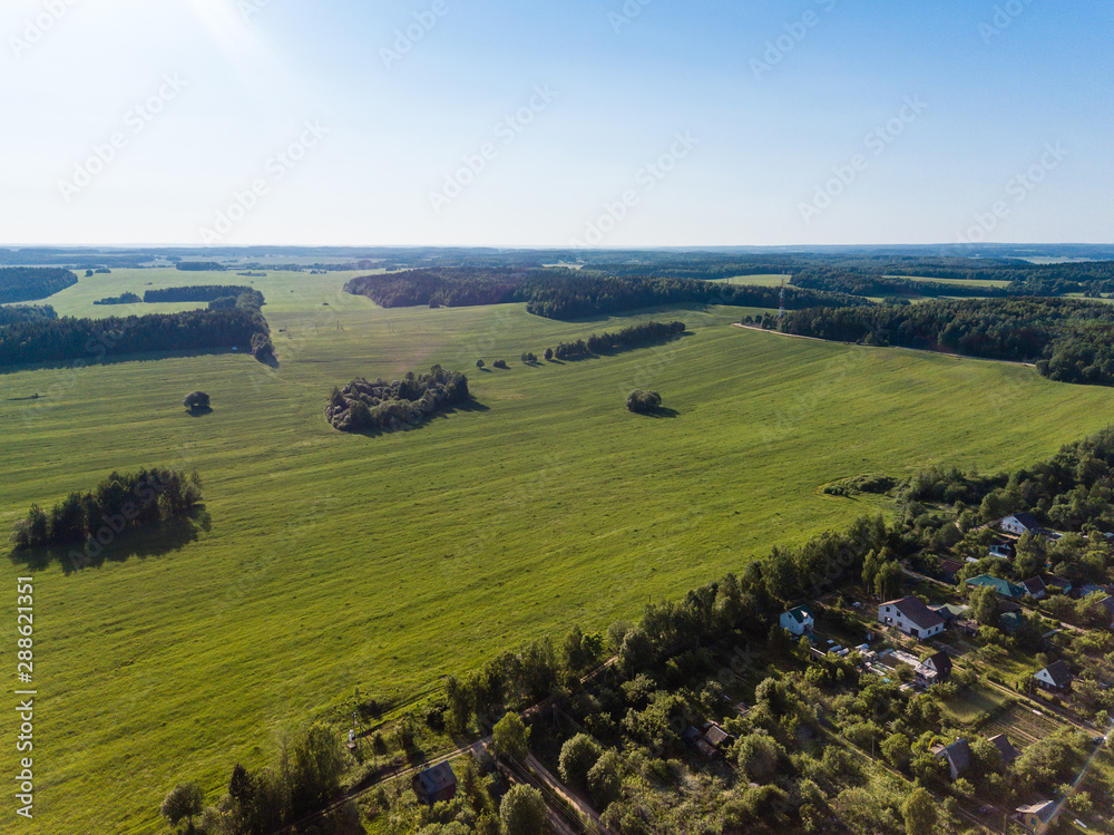 aerial photography rural landscape green fields, meadows and forest
