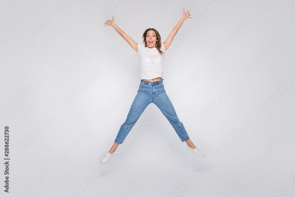Full length body size photo of cheerful gorgeous childish girl trying to take shape of star while isolated with white background