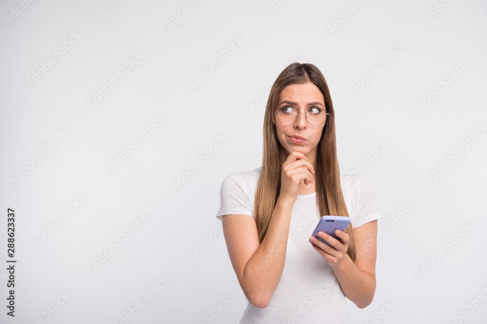 Photo of thinking pensive contemplating girl lost in thoughts while isolated with white background Photo of thinking pensive contemplating girl lost in thoughts while isolated with white background