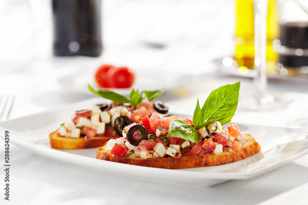 Italian Appetizer Bruschetta with Tomatoes, Cheese and Basil Italian Appetizer Bruschetta with Tomatoes, Cheese and Basil