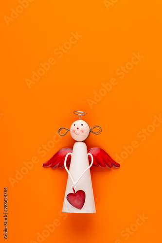 Christmas decor. Christmas decorations on orange background. Flat lay, top view, copy space.