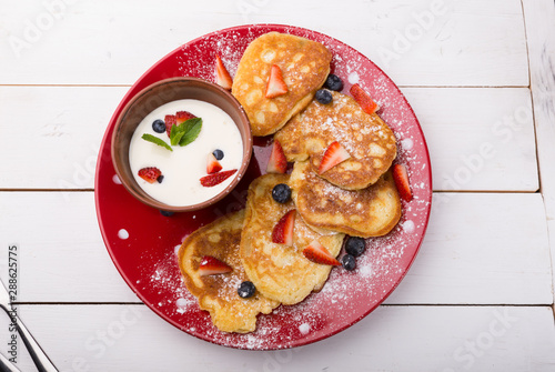 Pancakes with berries and cream