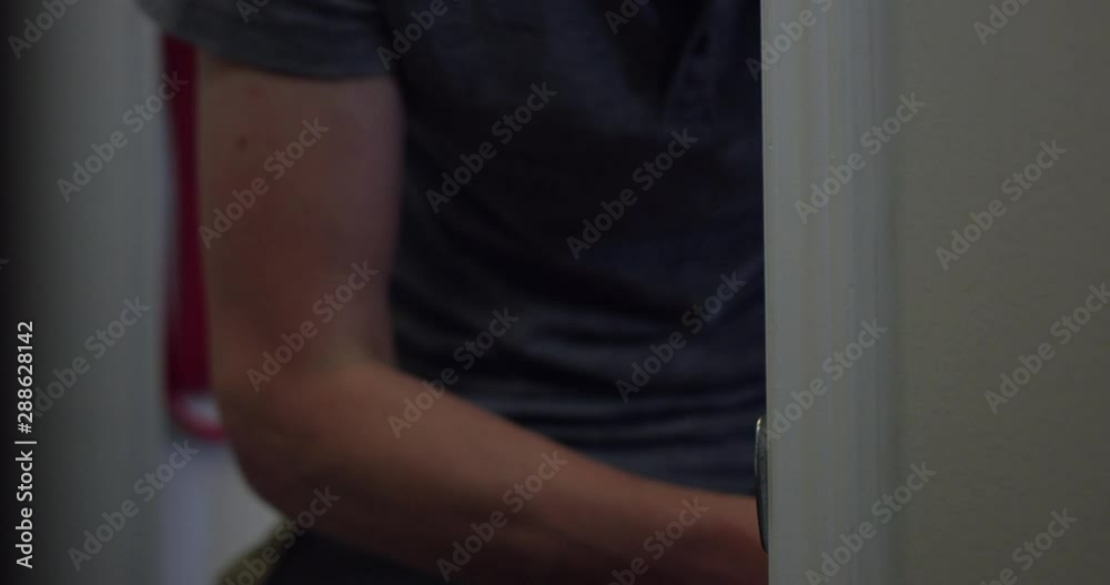DIY home owner installing new door handles - close up on preparing door frame DIY home owner installing new door handles - close up on preparing door frame